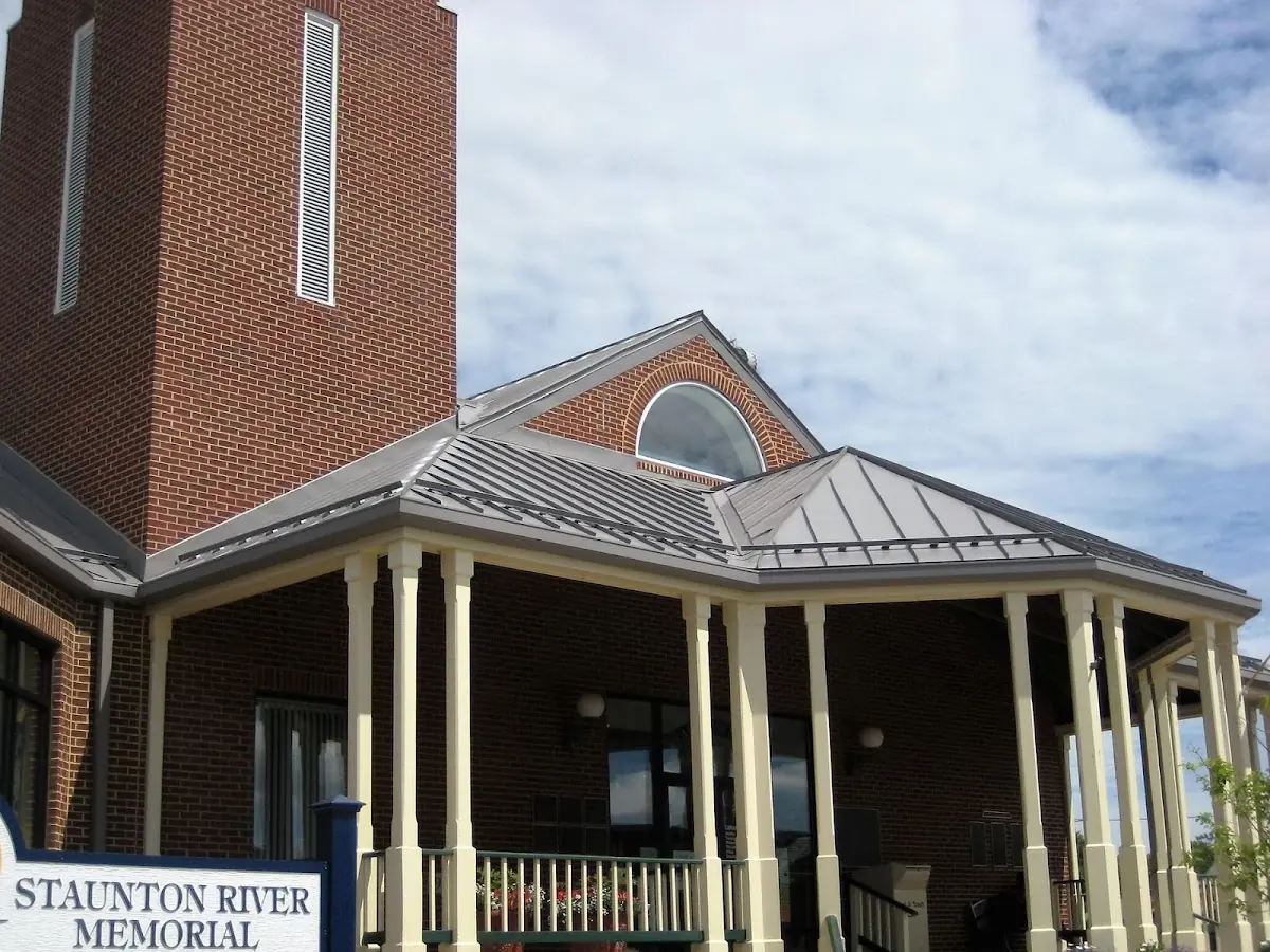 Skilled roofing craftsmen working on a residential roof in Belle Haven